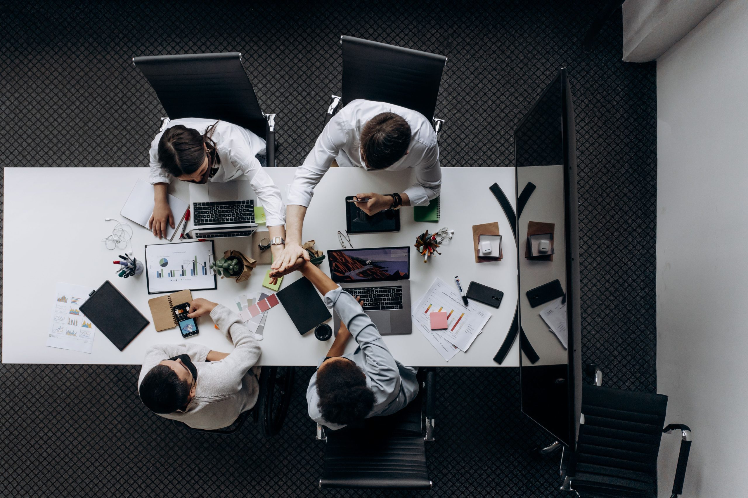 Professional business team having a meeting inside a modern office environment.